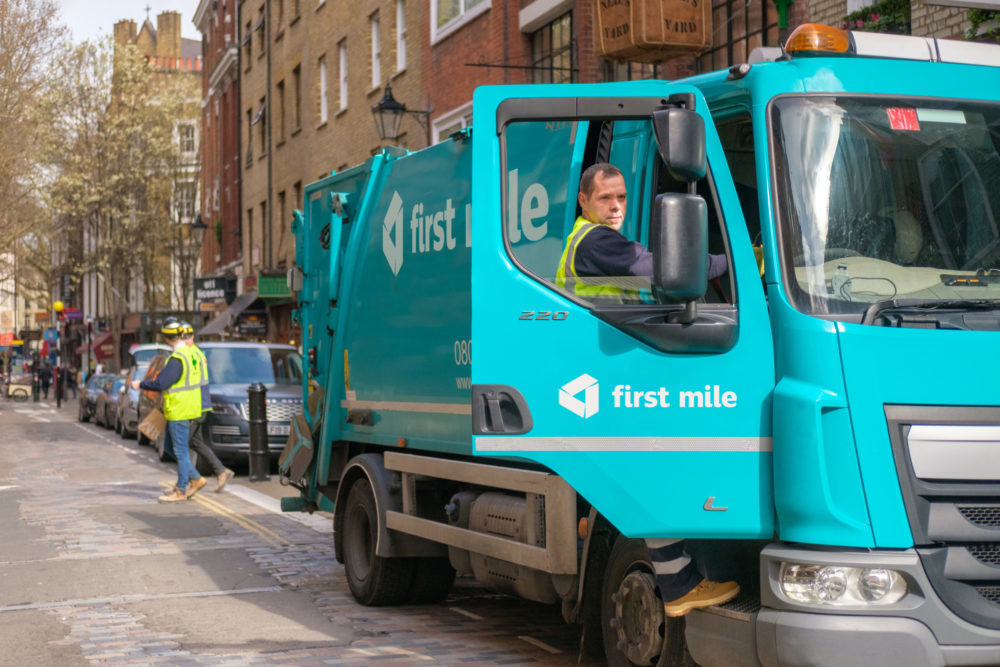 First mile bin workers and a truck