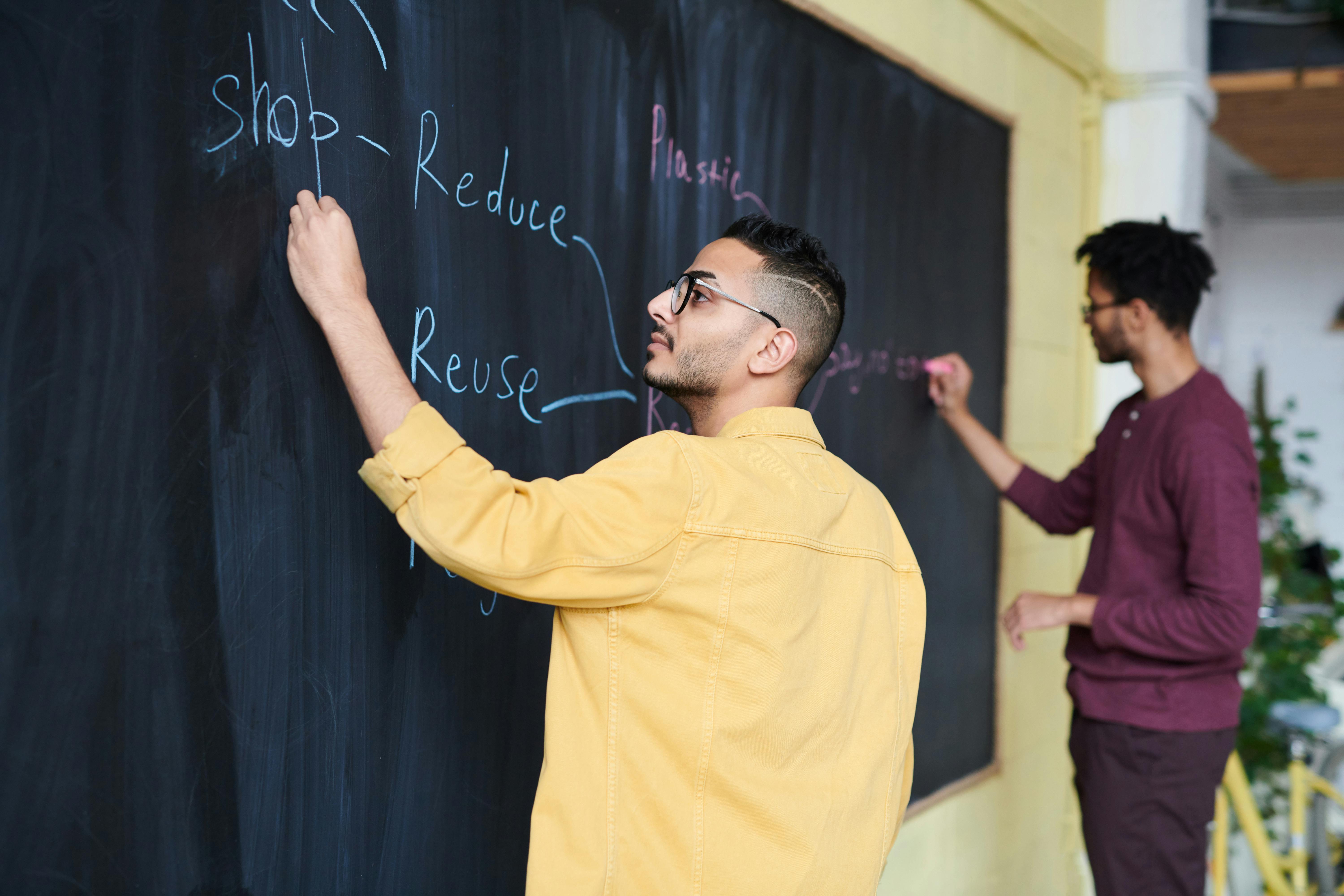 office workers with black board writing recycle notes
